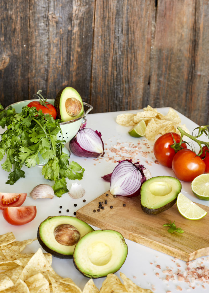 guacamole with avocados, tomatos, red onion, lime, cilantro, peppers + tortilla chips
