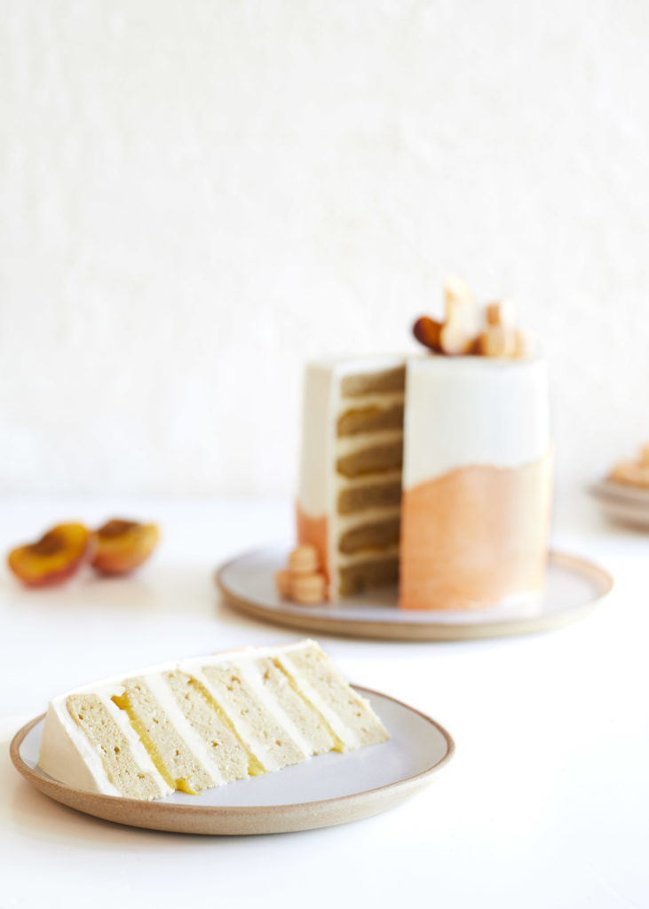 gluten free sour cream brown sugar peach upside down cake with swiss meringue buttercream