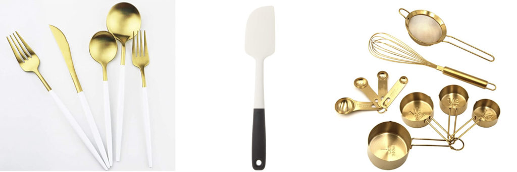 gold + white cutlery, gold measuring cups + a spatula