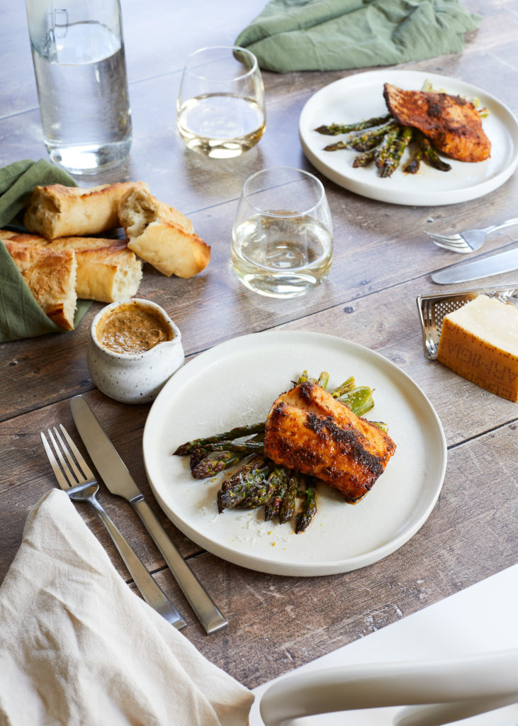 cajun cod served with lemon parmesan asparagus, white wine + bread
