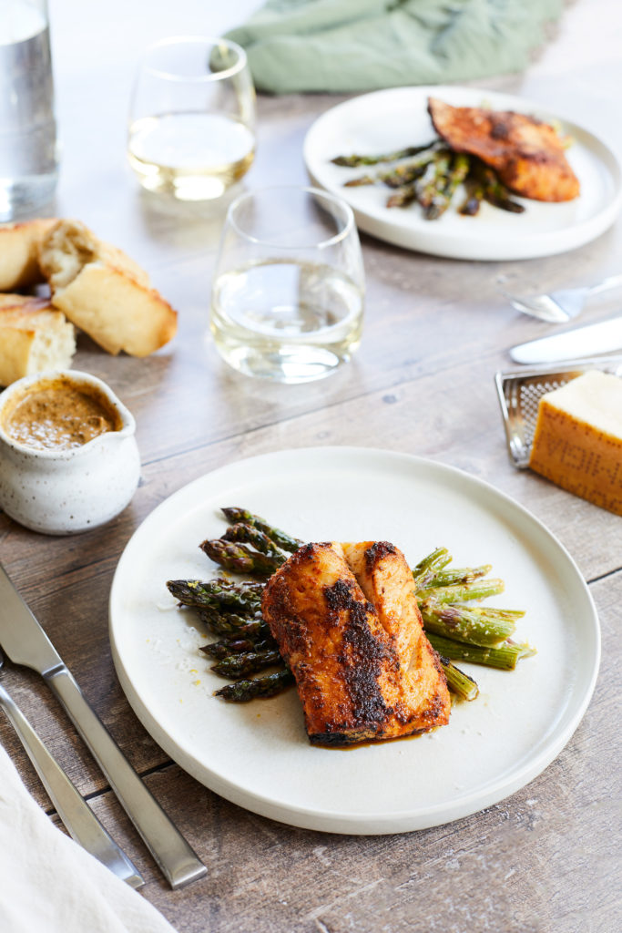 cajun cod served with lemon parmesan asparagus, white wine + bread
